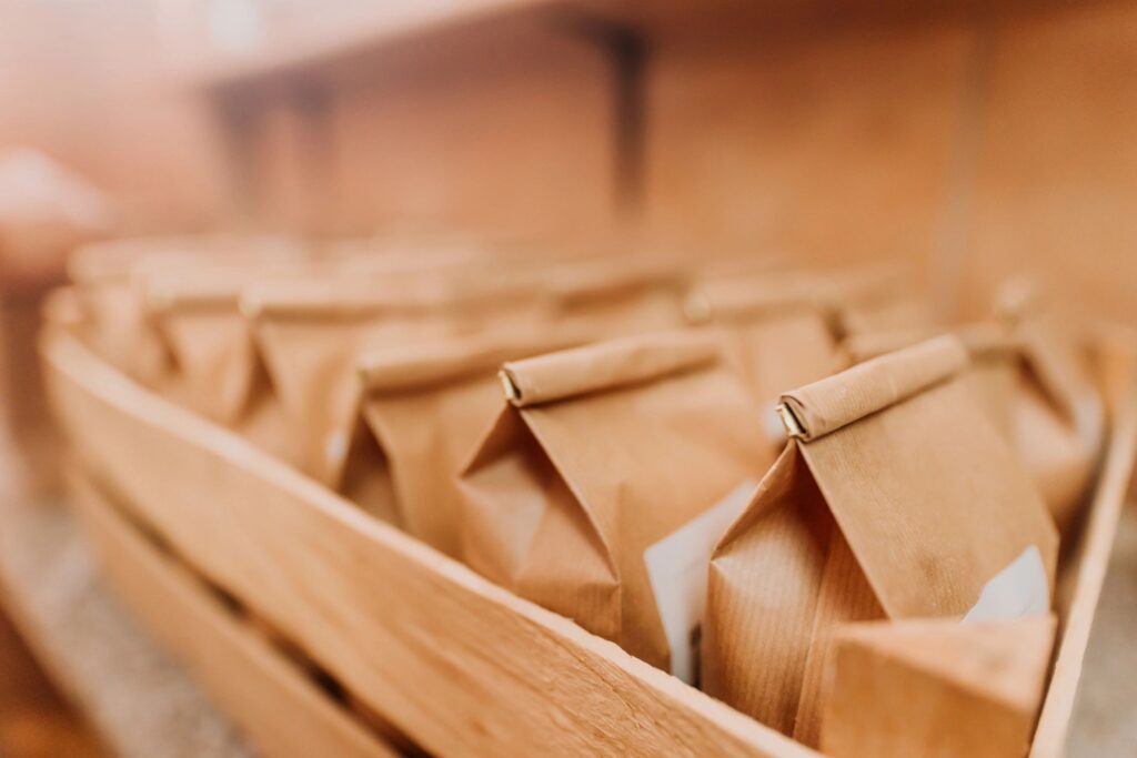 Row of flour paper bags in wooden crate