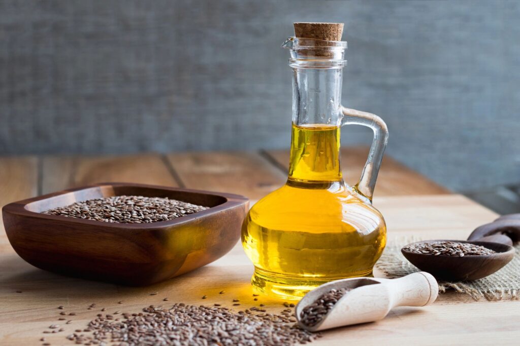 A bottle of flax seed oil on a wooden table